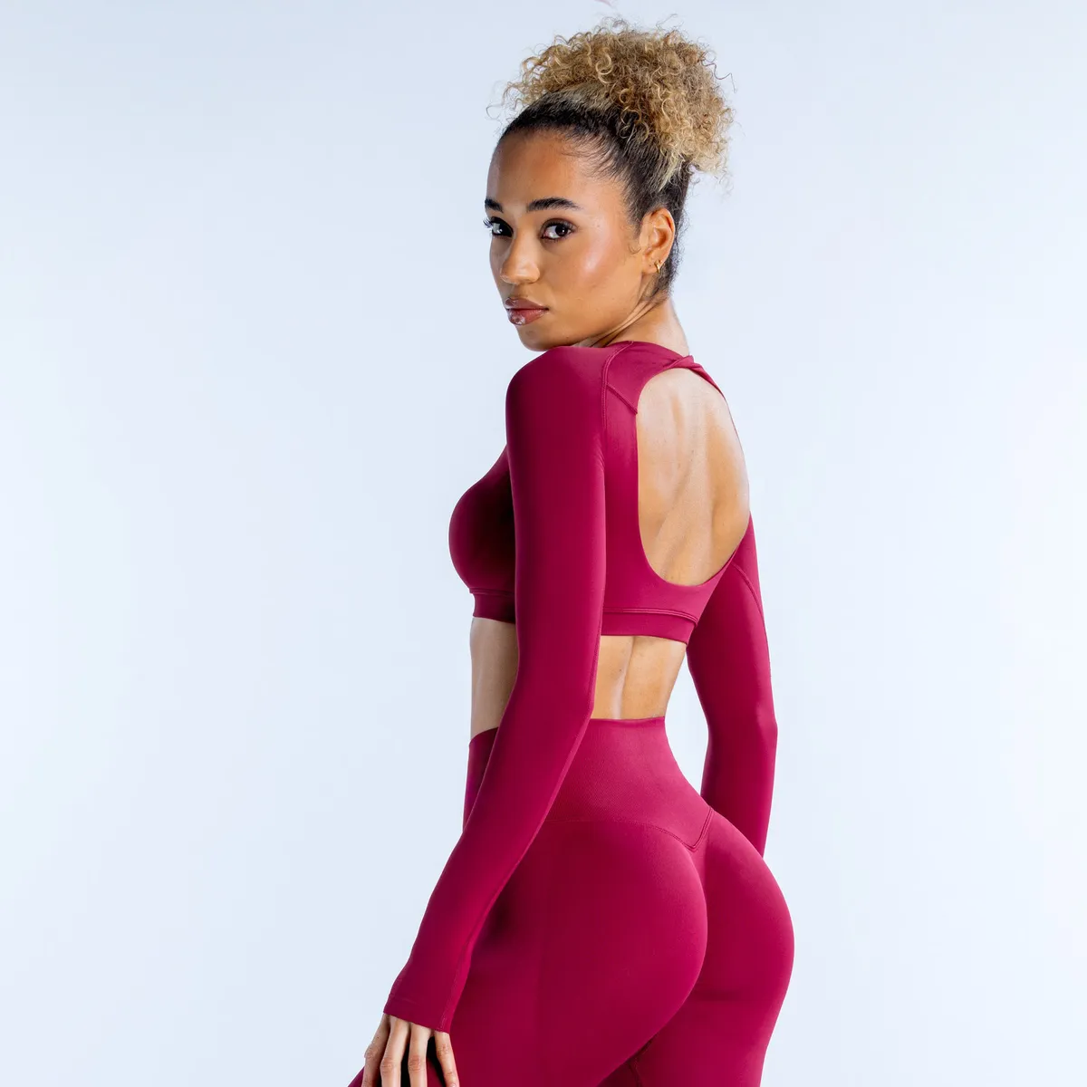 DFYNE Women's Crewneck Long Sleeve Crop Top with Hollow Back - Breathable Yoga & Athletic Wear for Active Lifestyles showcase 5