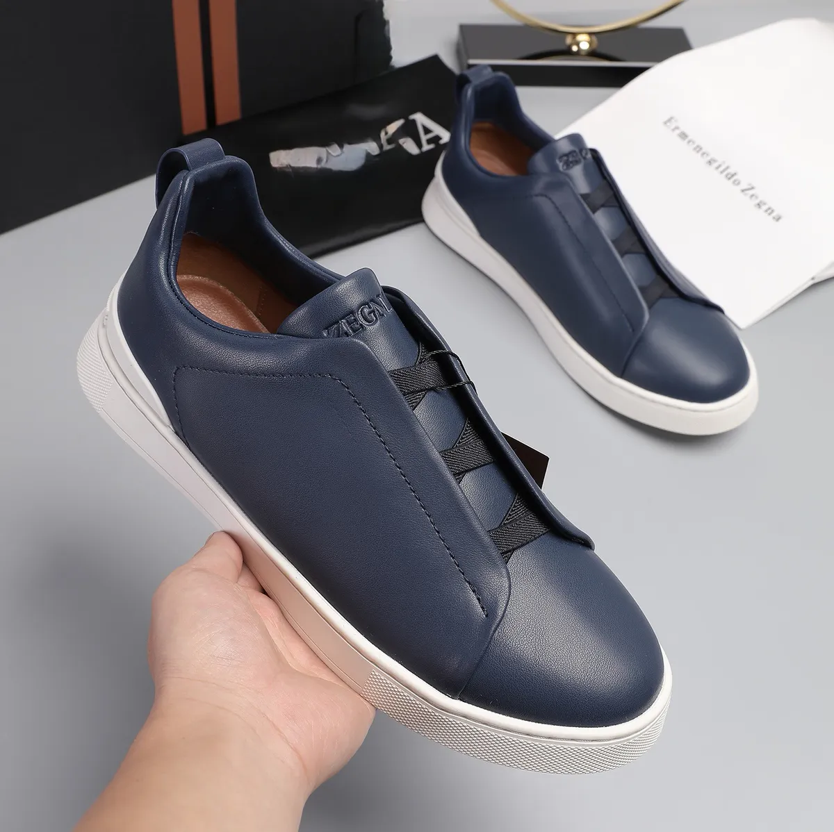 Men's Lightweight Cowhide Leather Sneakers, Breathable Slip-On Casual Sports Shoes, Versatile Low-Cut White Tennis Shoes for Daily Wear showcase 7