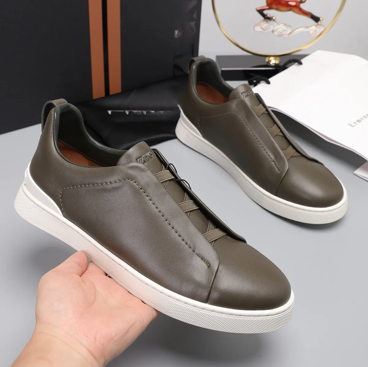 Men's Lightweight Cowhide Leather Sneakers, Breathable Slip-On Casual Sports Shoes, Versatile Low-Cut White Tennis Shoes for Daily Wear showcase 8
