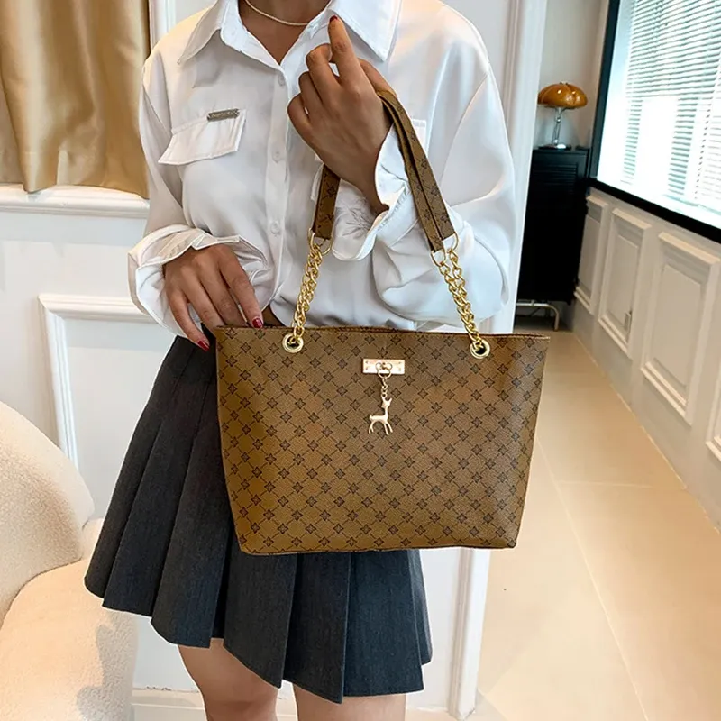 Luxury Handbag Texture Soft Leather Large Capacity Tote Bag for Women, Versatile Shoulder Bag with Hanging Accessories, Stylish Everyday Carryall showcase 12