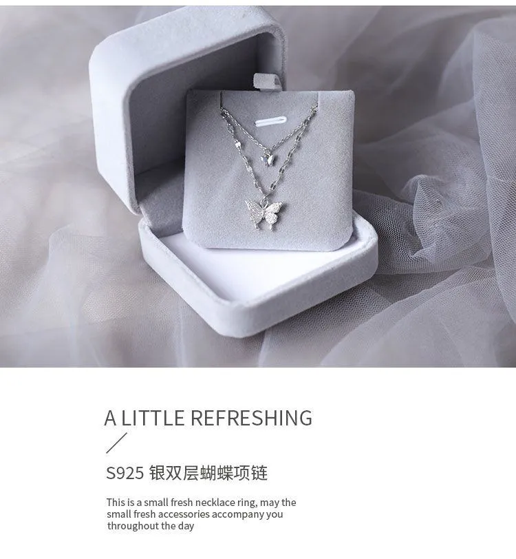 Women's Silver Tone Double Layer Butterfly Pendant Necklace with Sparkling Crystal Accents and Grey Velvet Box showcase 7