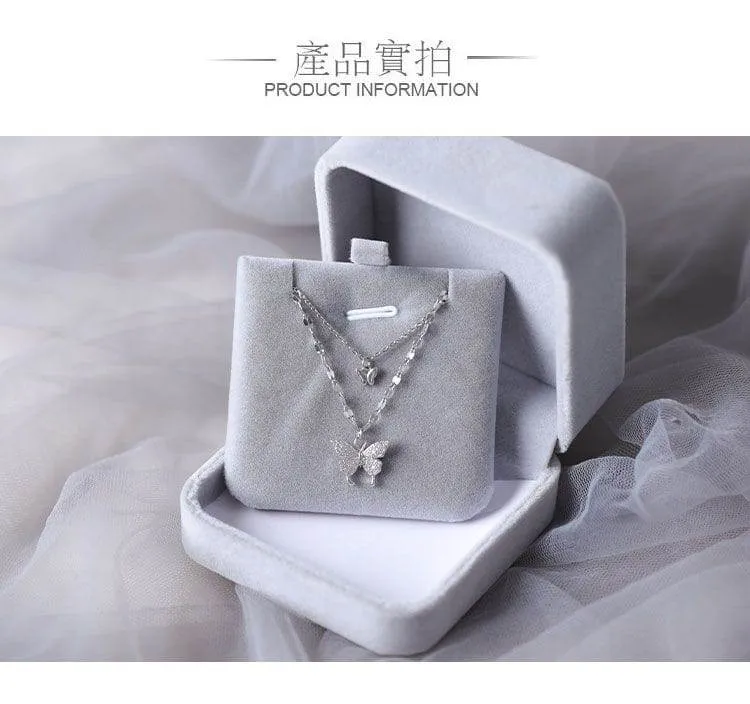 Women's Silver Tone Double Layer Butterfly Pendant Necklace with Sparkling Crystal Accents and Grey Velvet Box showcase 5
