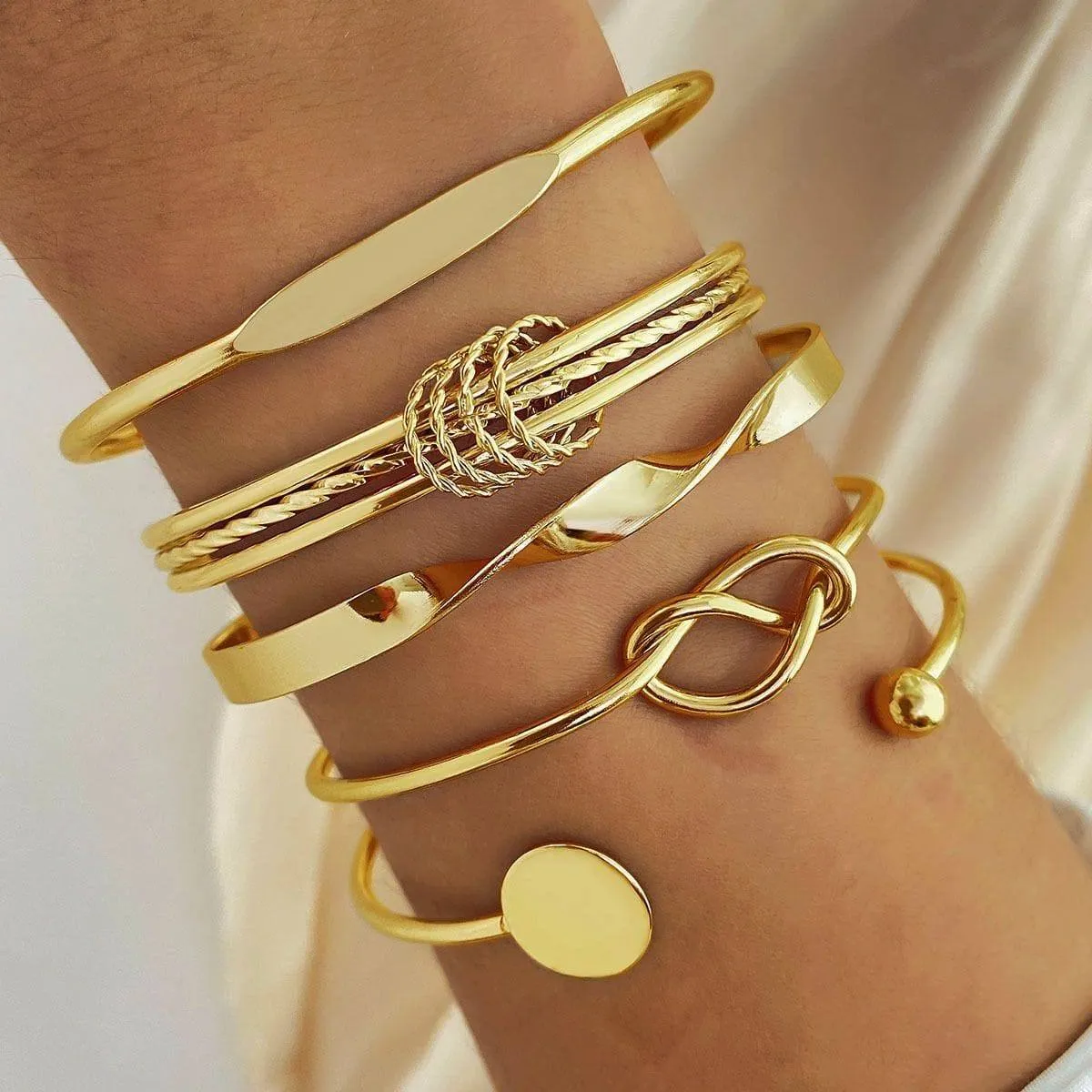 Women's 6-Piece Gold Tone Bangle Bracelet Set Stackable Cuff Set with Knot and Geometric Disc Details thumbnail 7