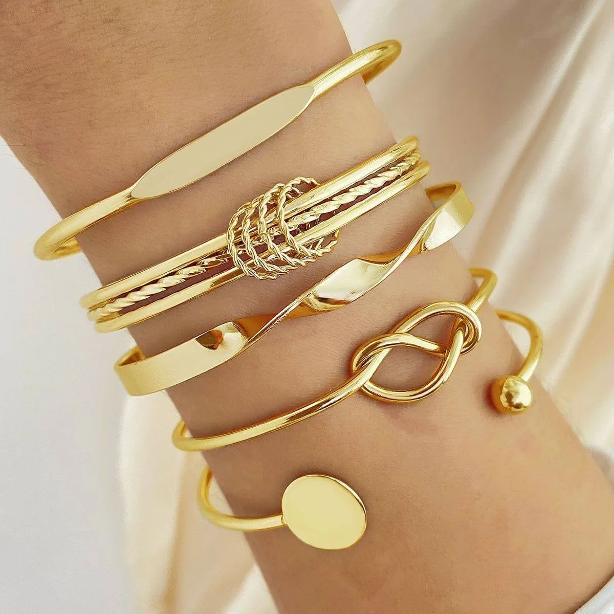 Women's 6-Piece Gold Tone Bangle Bracelet Set Stackable Cuff Set with Knot and Geometric Disc Details thumbnail 3