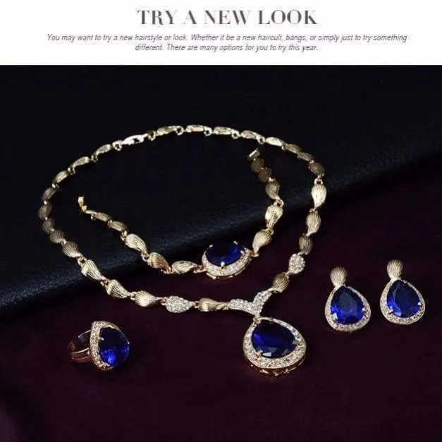 Women's 4-Piece Gold Tone Ruby Red Teardrop Gemstone Jewelry Set Necklace Bracelet Ring and Earrings Formal Evening showcase 4